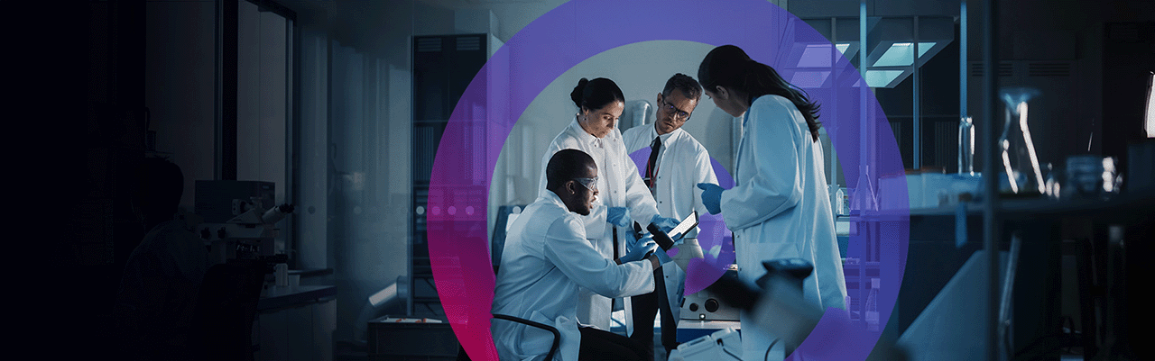 4 people in a dark lab wearing white lab coats analysing reports. there are test tubes and a telescope in the background. There is also a pink and blue gradient cora lens logo in the back middle of image.