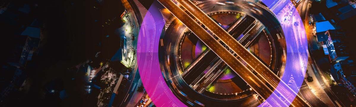 Cross road junction in the US with the Cora Systems pink and purple focus logo in the background.