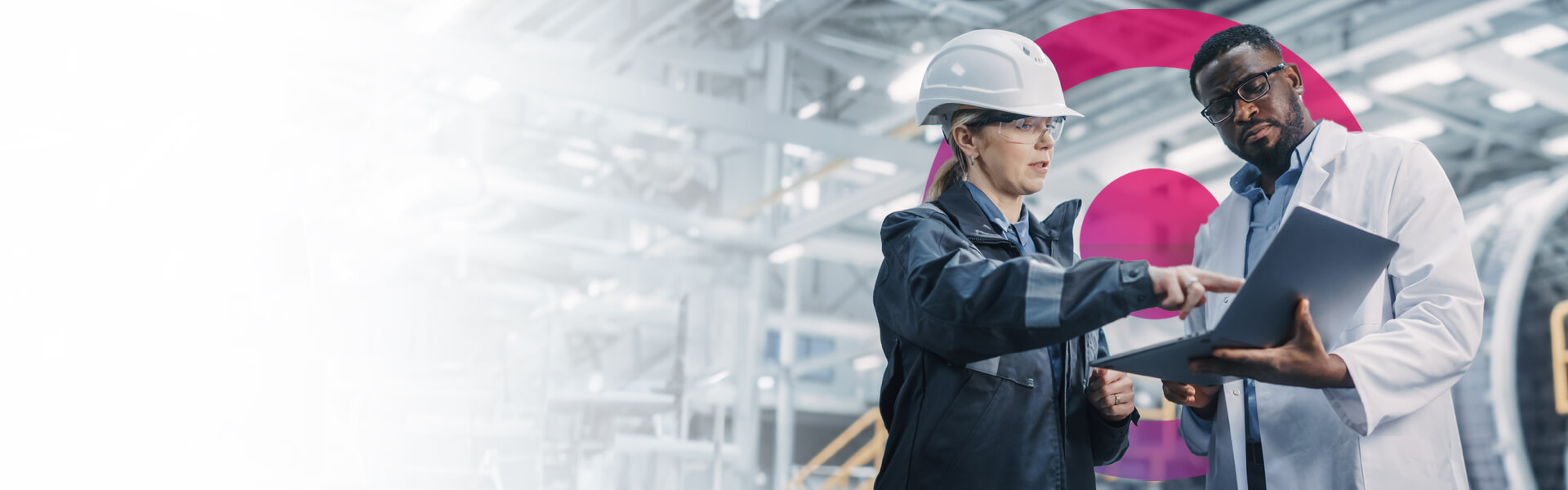 Woman engineering working on aerospace machinery wearing a blue suit and white hard helmet.