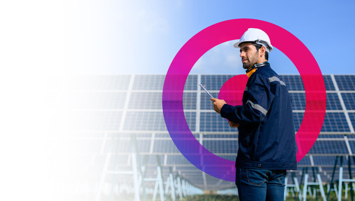 ESG - man with notepad at a solar panel field