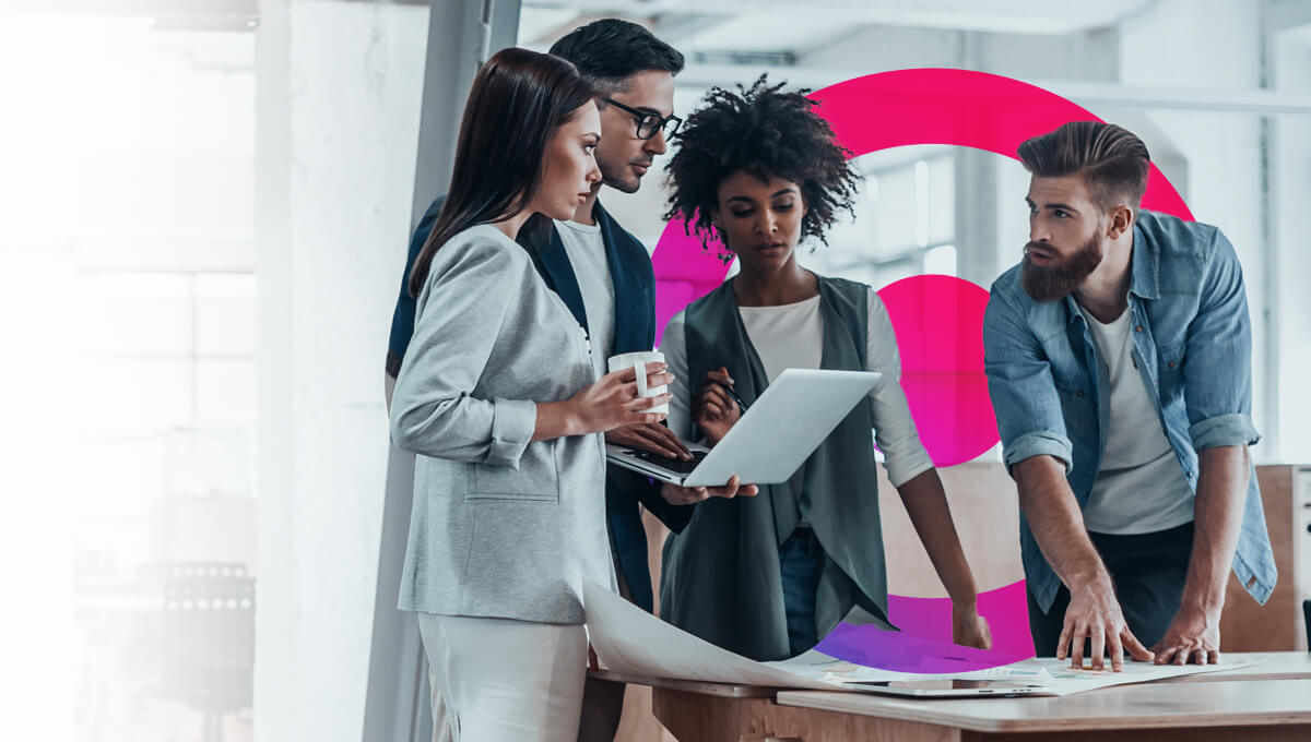 4 people having a meeting in an office