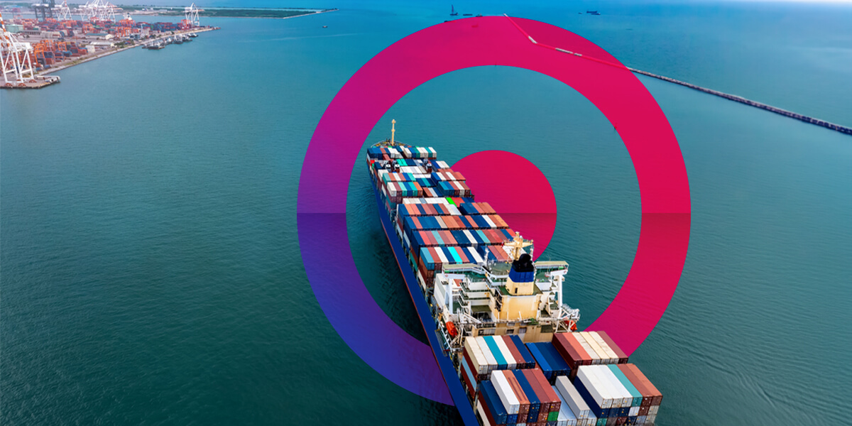 A large cargo ship carrying containers across the ocean. Pink and purple gradient lens in the background.