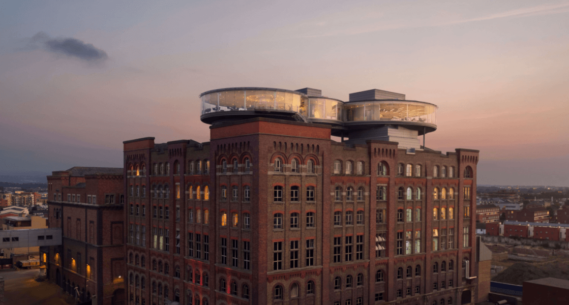 Building with skybar view on the top and sunset behind